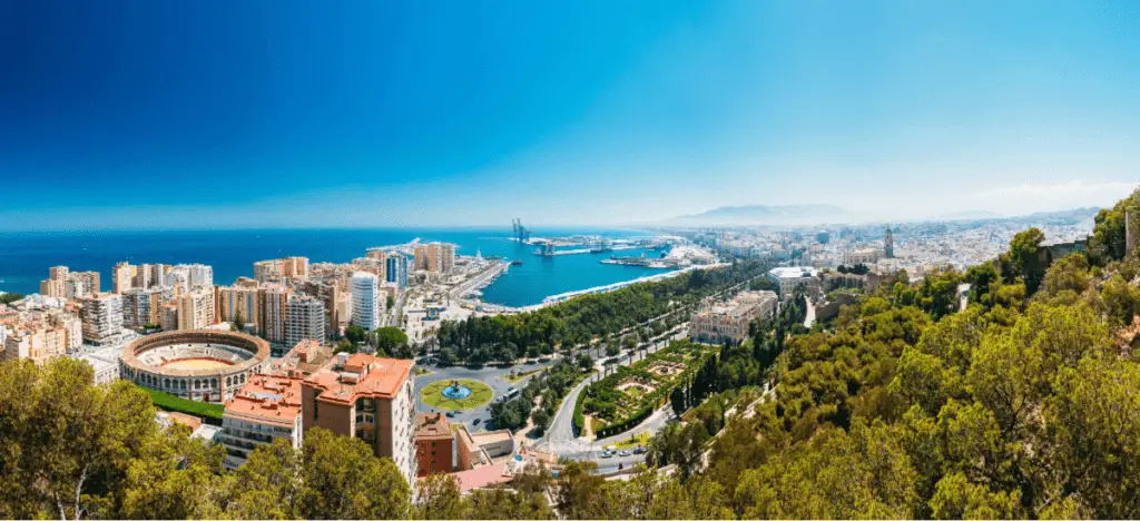 view of the beautiful port of malaga, bull ring and city hall