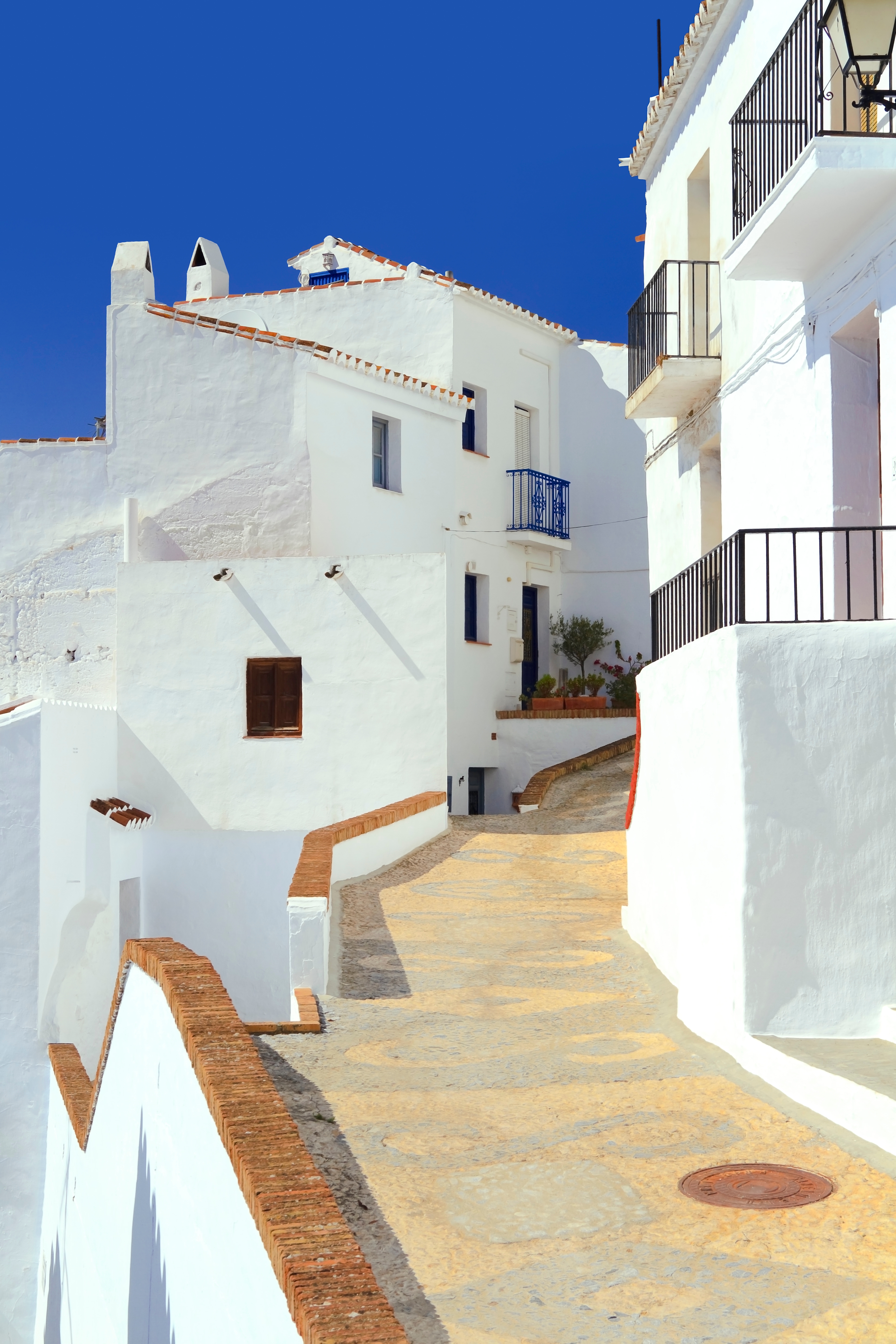 Pathway through the white village Frigiliana