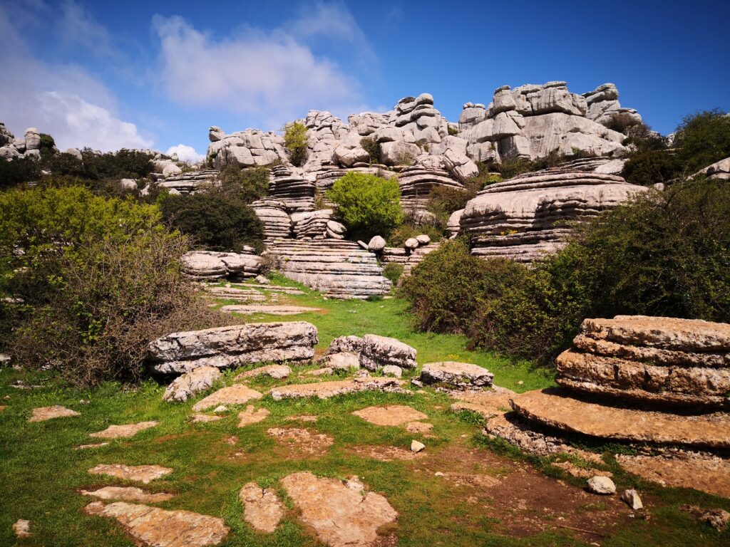 Scenic wide shot of the unique karst limestone rock formations in El Torcal de Antequera nature reserve, Malaga, Spain.