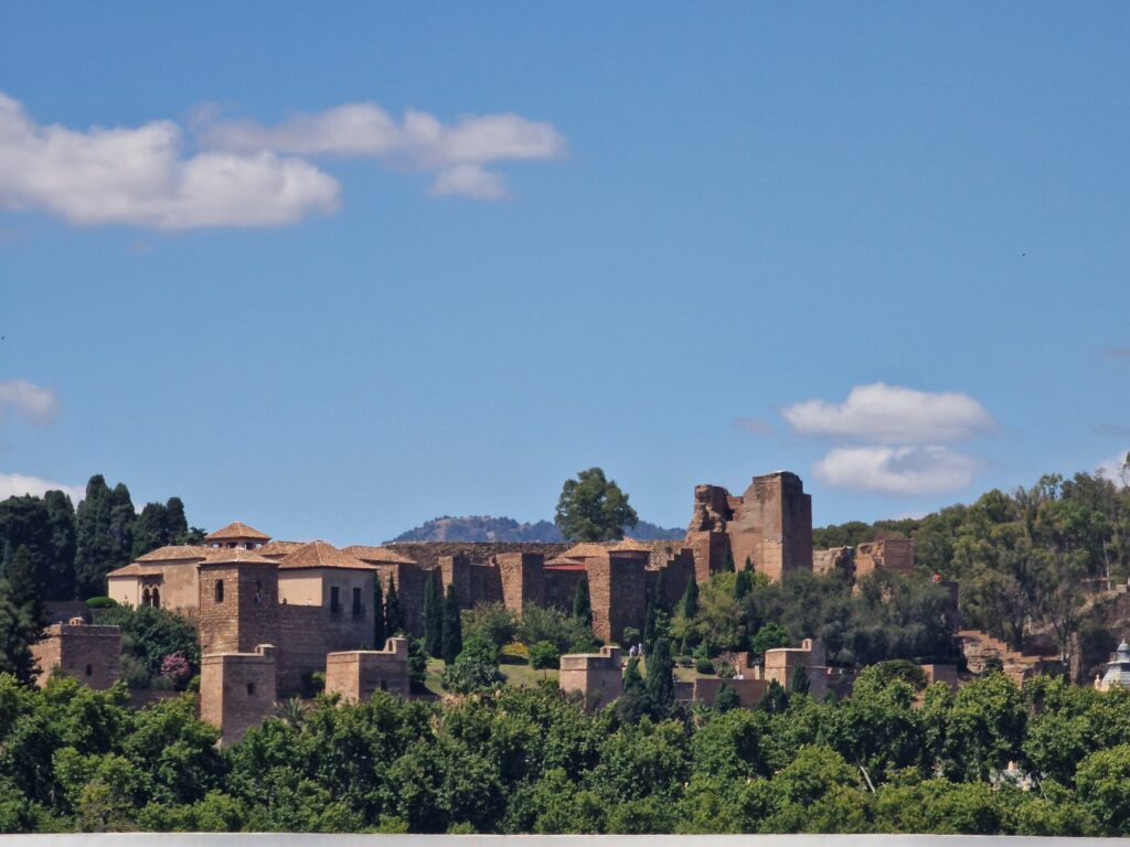 View of the historic Alcazaba fortress perched on the hill above Malaga city center