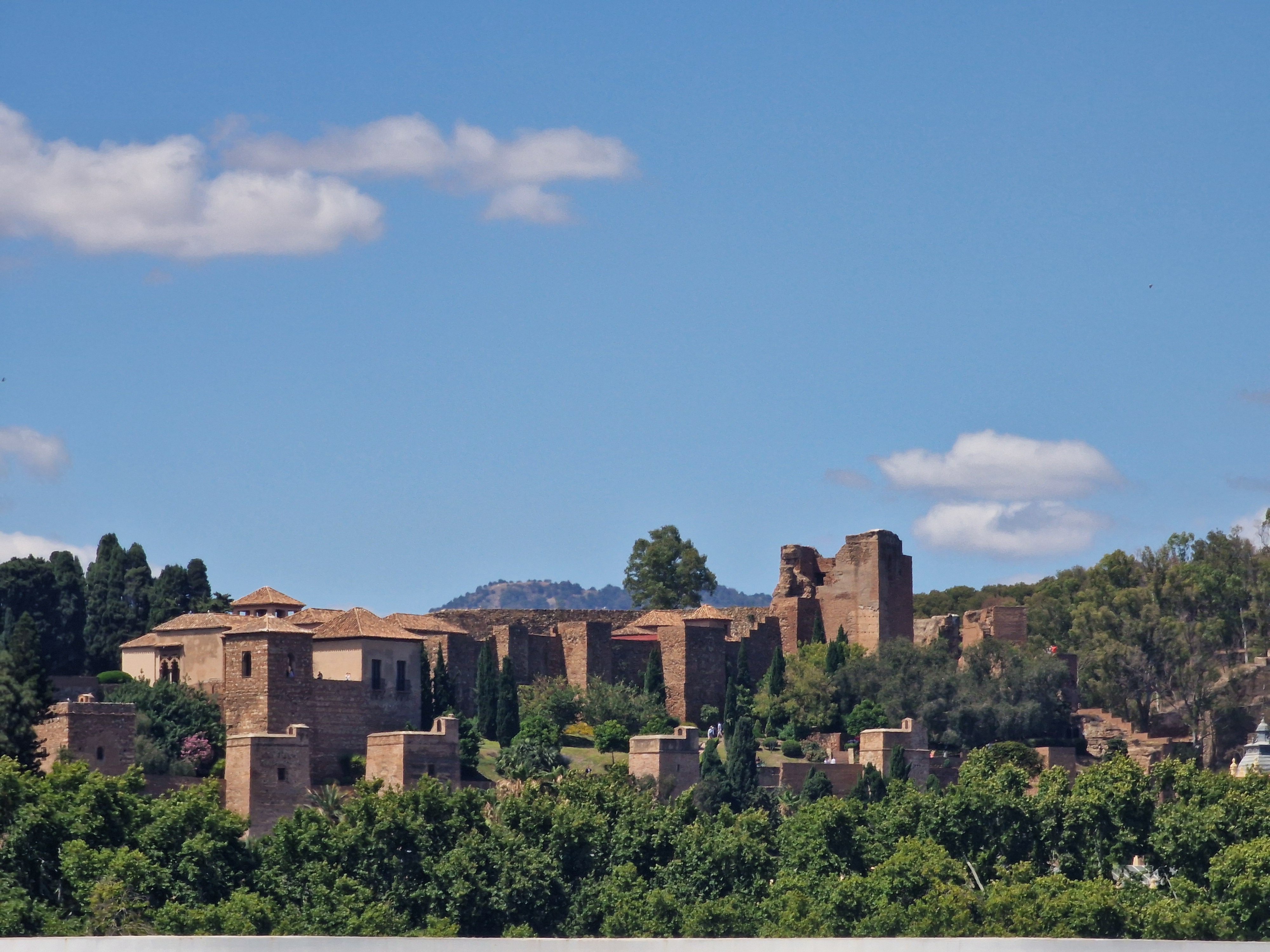 View of the historic Alcazaba fortress perched on the hill above Malaga city center