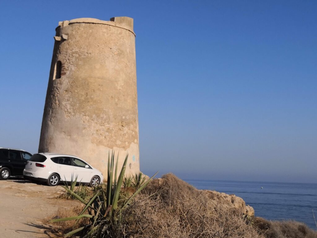 The historic Torre de Benagalbón coastal watchtower overlooking the sea in Rincón de la Victoria.